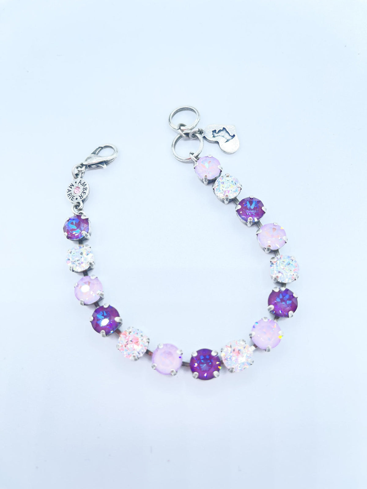 Classic Paris bracelet featuring lavender, lilac, white, and light green stones with an amber tag heart charm.