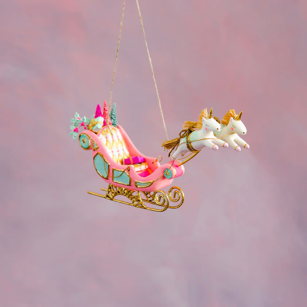 Hand-painted gold leaf Parisian sleigh ornament with intricate detailing.