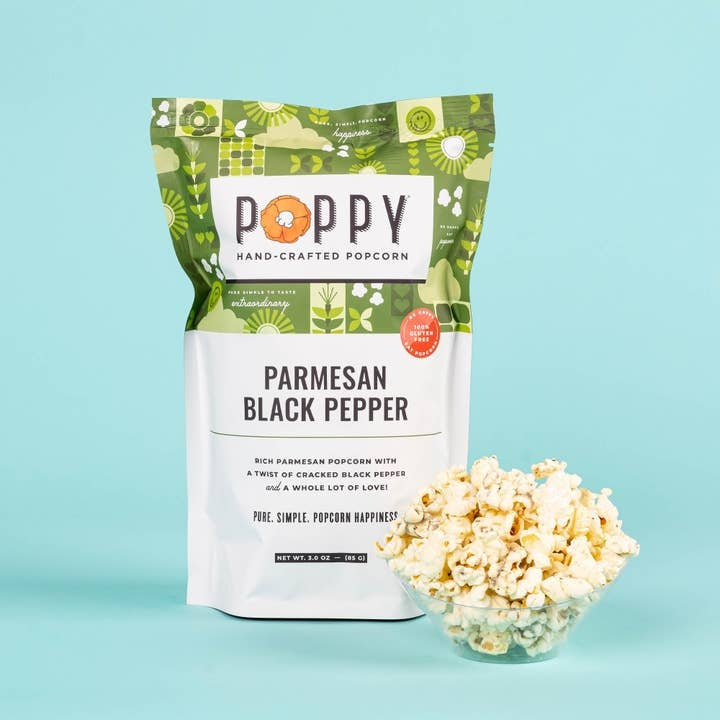 Open bag of Market Bag Popcorn in white cheddar vinegar dill flavor with visible seasoning.