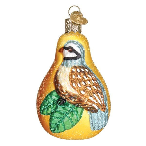 Partridge in a Pear ornament featuring a partridge perched on a pear branch with green leaves.