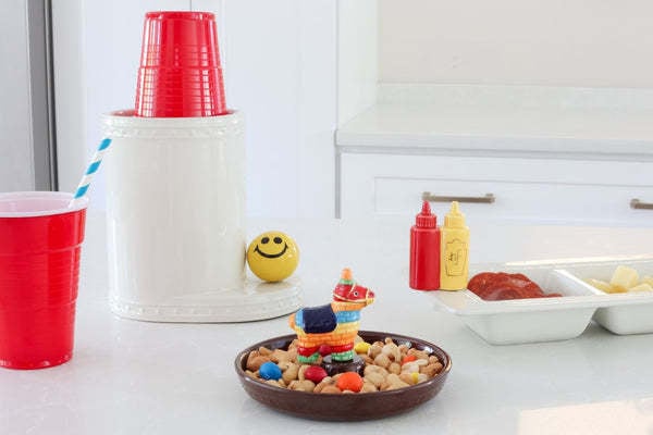 Plush Party Animal toy in bright colors with a festive friendly face.