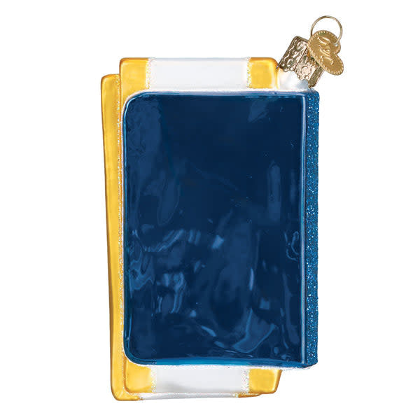 Back view of a passport-shaped ornament with gold foil stamping on dark blue leather-like material.