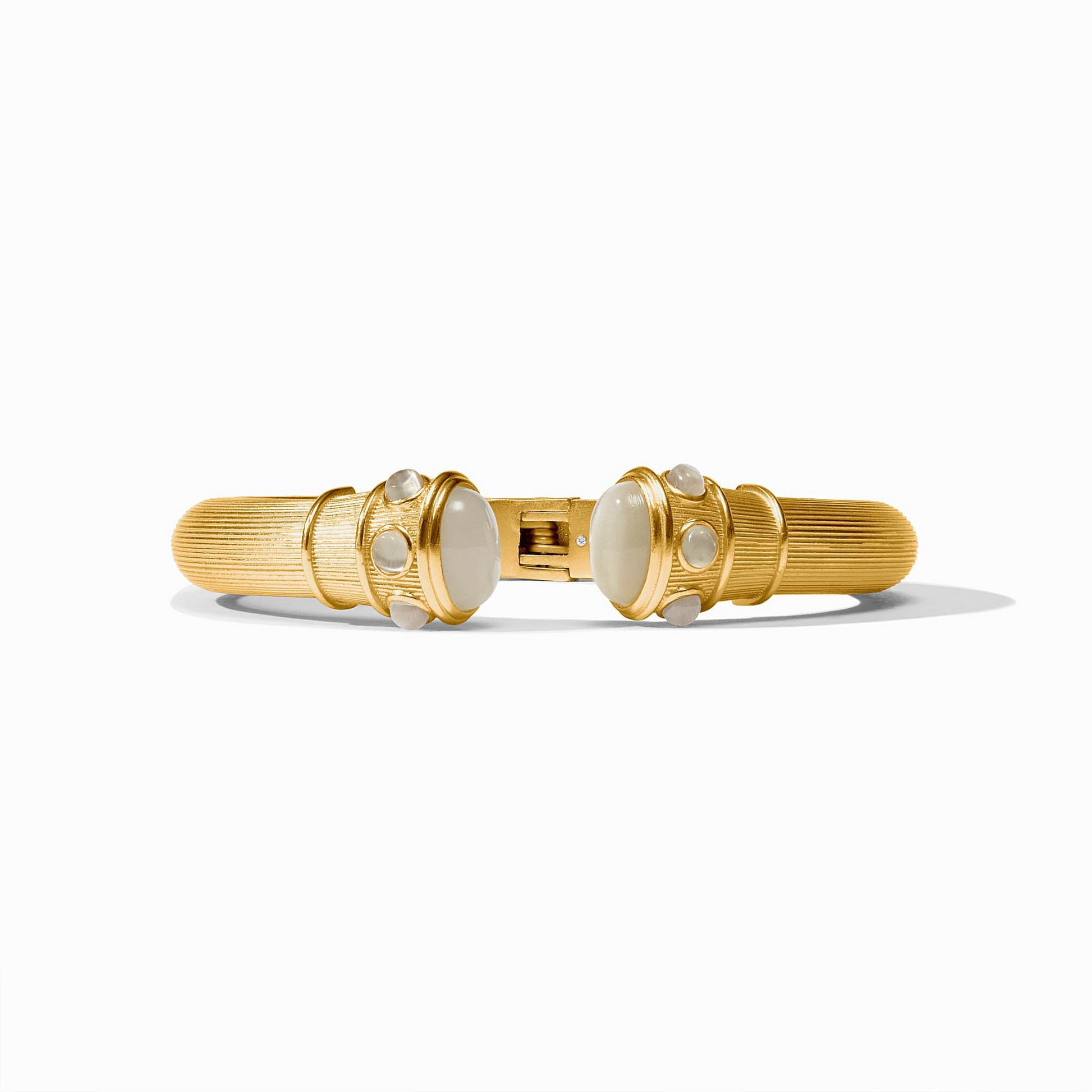 Gold-plated Cobblestone Demi Cuff with white glass cabochons and a spring hinge closure.
