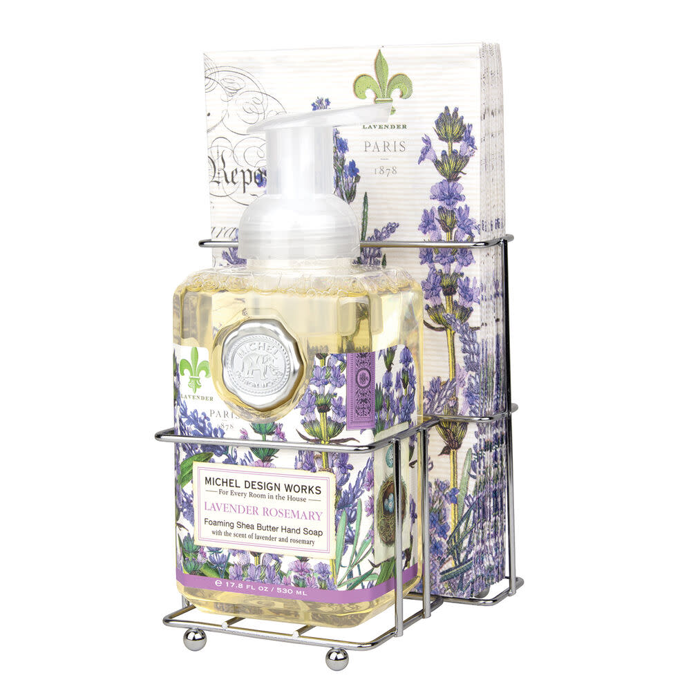 Foaming hand soap dispenser with matching napkin holder set in neutral tones.