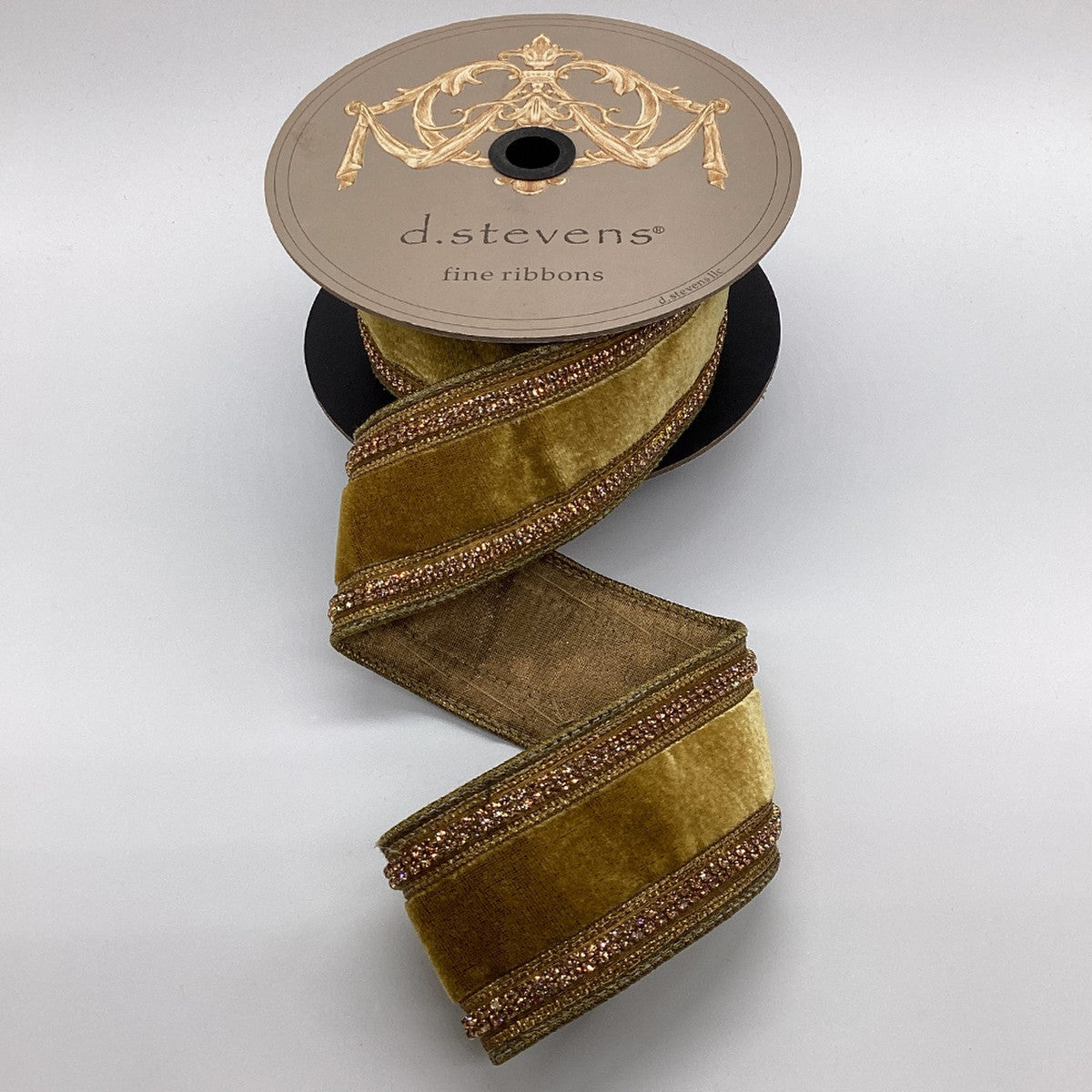 2.5 inch gold velvet ribbon with jewel side trim on a d.stevens spool.