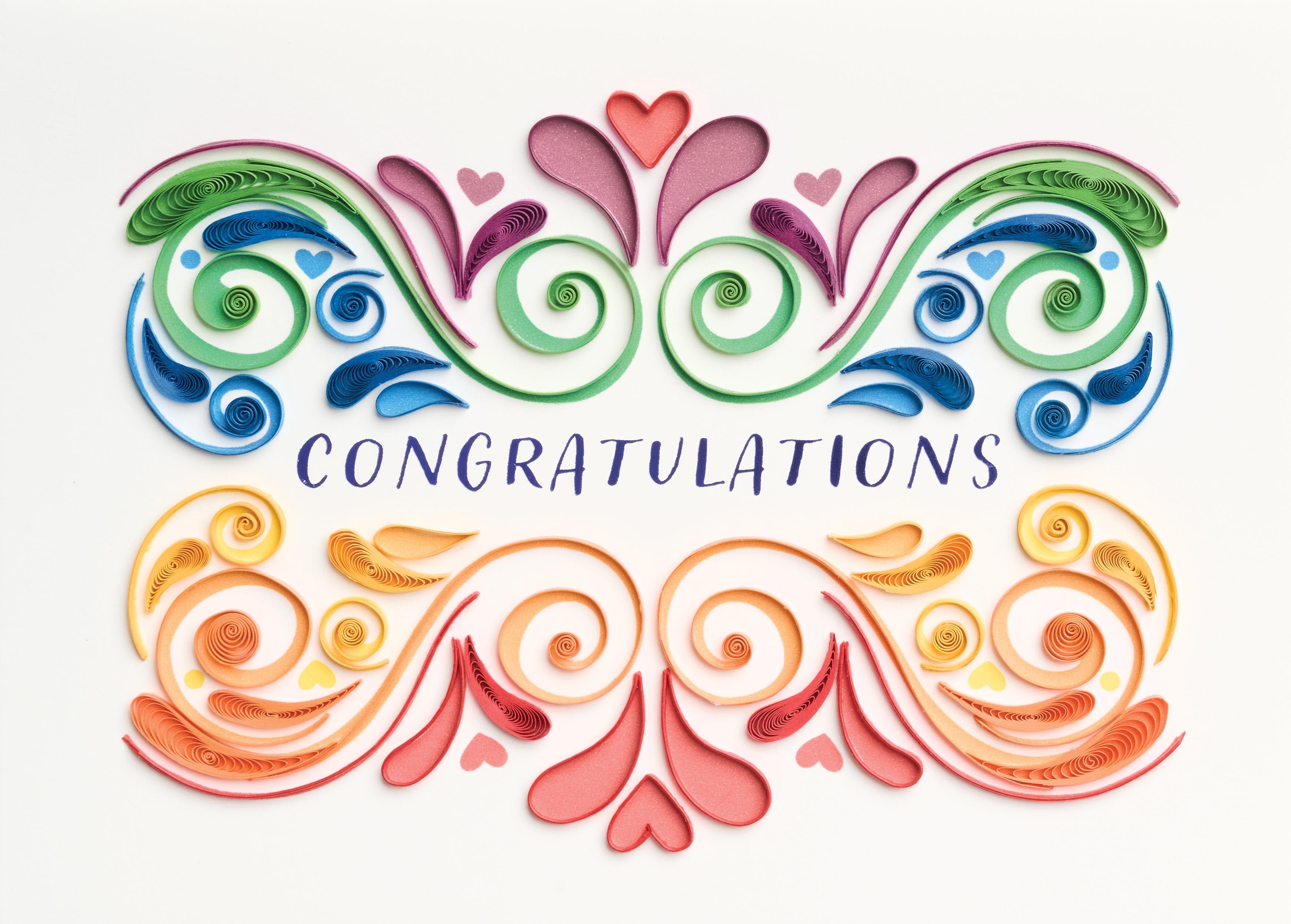 Front view of a vibrant congratulations greeting card with bold joyful artwork on white paper.