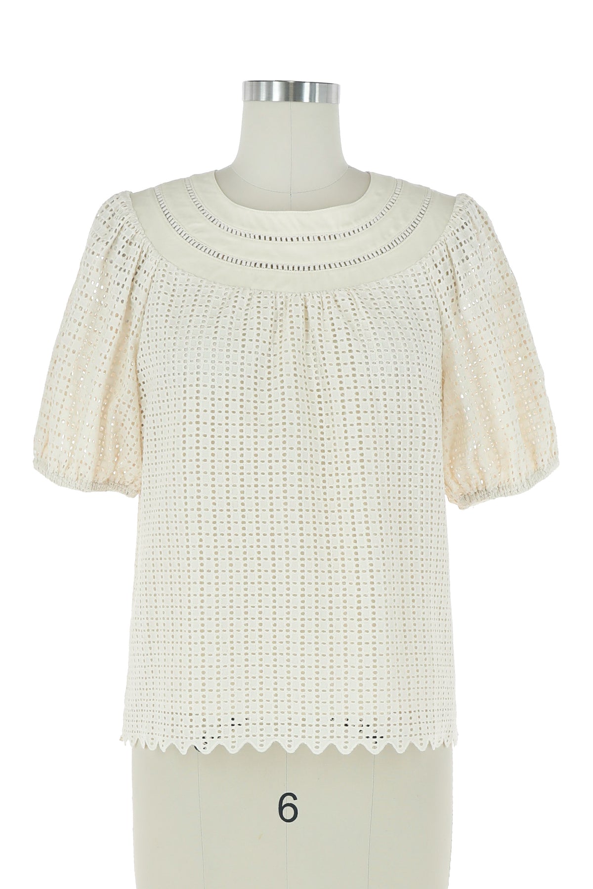 Clara Short Sleeve Blouse in cream eyelet fabric with a scalloped hem and puff sleeves.