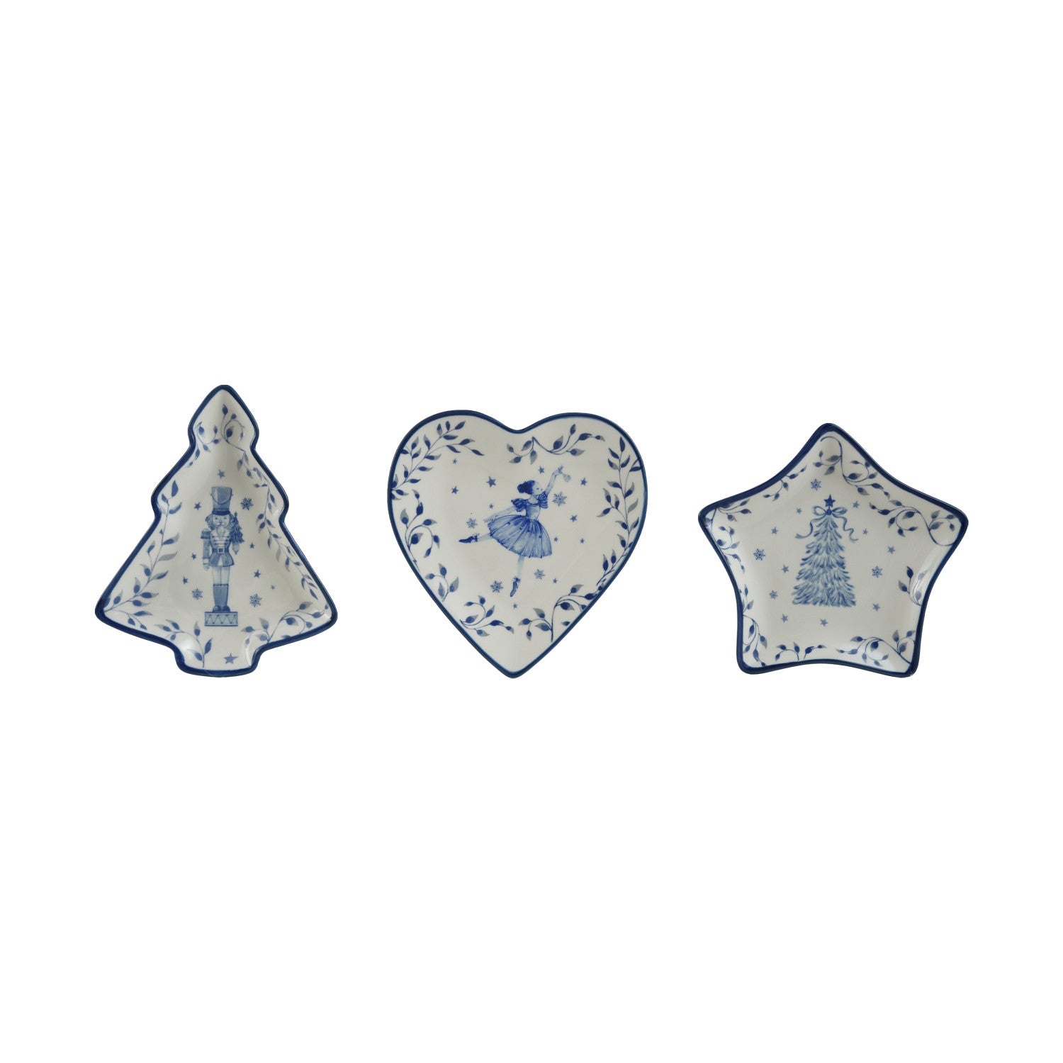 Three white ceramic holiday dishes with blue trim and designs: nutcracker, ballerina, and tree.