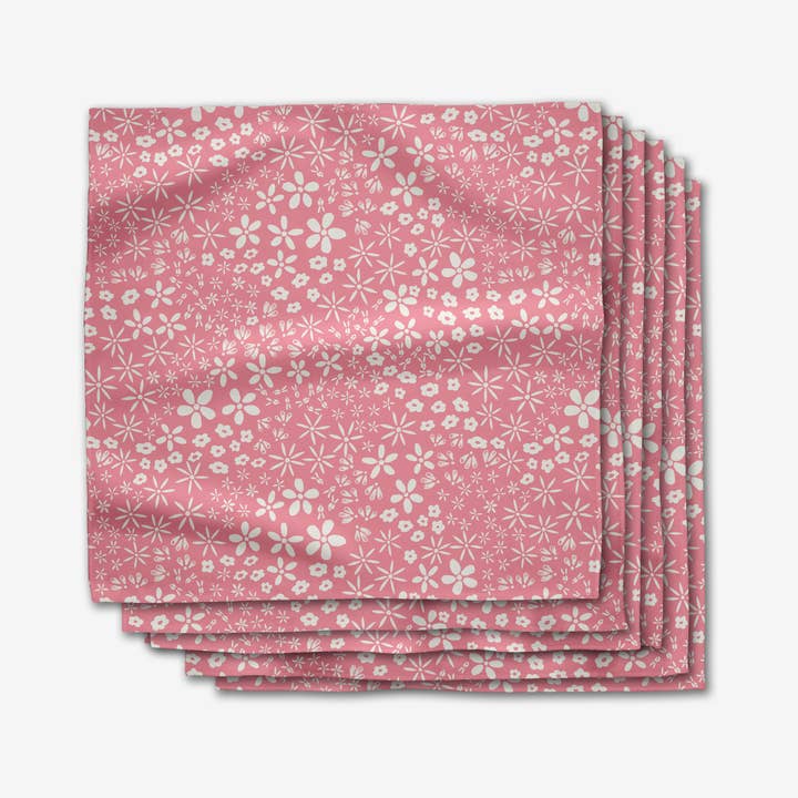 Set of six square Geosuede dinner napkins with a single-sided print pattern.