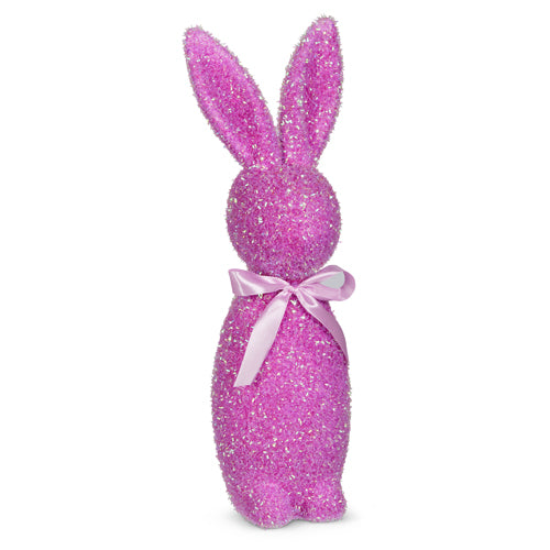 Sixteen-inch tall iridescent purple flocked bunny made of foam with glitter and polyester.