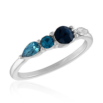Multi transitioning stone stack ring with blue, teal, and clear gems on a silver band.
