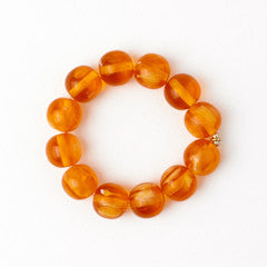 Cece Large Resin Bead Bracelet featuring oversized amber resin beads in a circular arrangement.