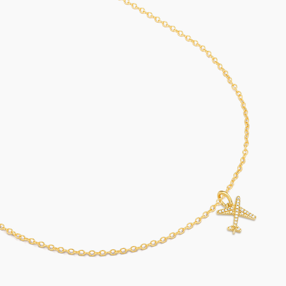 Sterling silver pendant necklace with gold-plated finish featuring a small diamond accent on an adjustable chain.