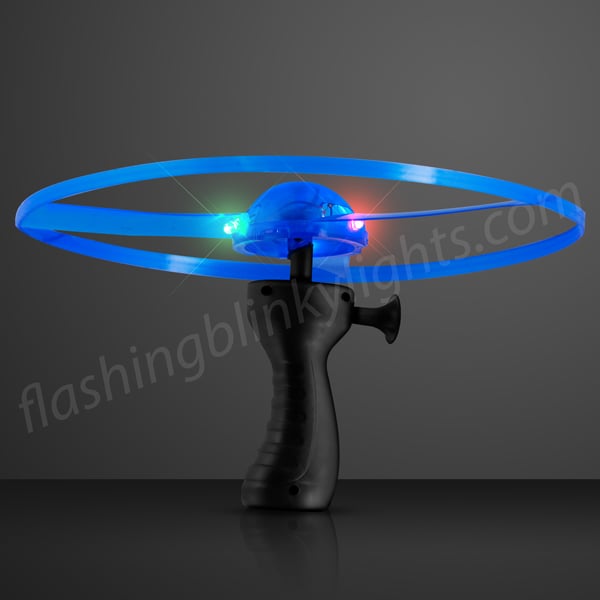 Red LED Light Up Whirly Wheel toy with replaceable batteries and pull-string launch mechanism.