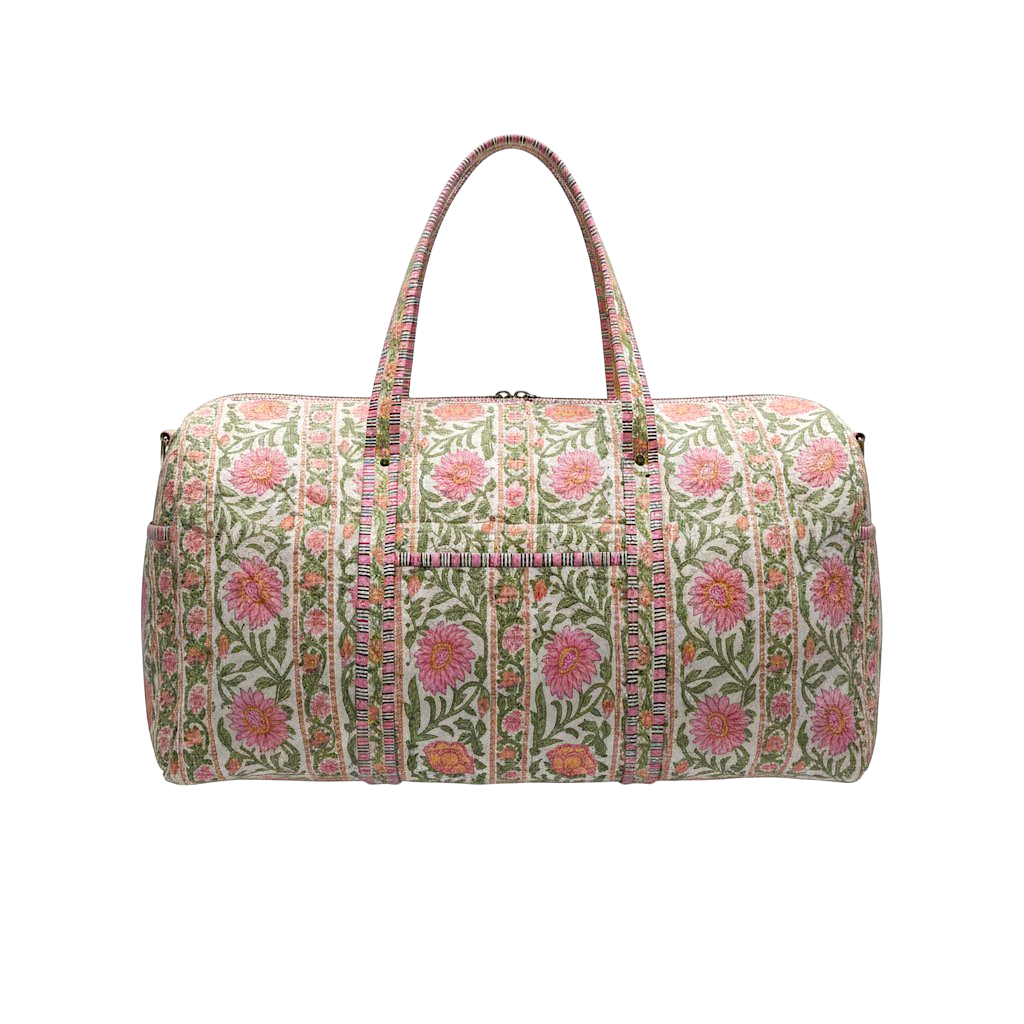 Quilted Gabby duffel bag with a pink and green floral block print pattern and top handles.