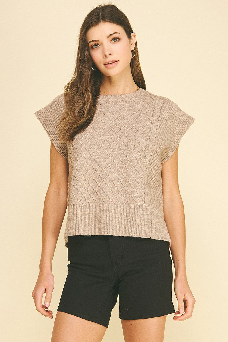 Lyndsey diamond cable knit sweater in soft gray with a relaxed fit silhouette.