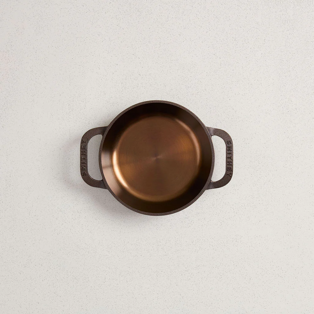 Top-down view of a No. 6 Dual Handle Skillet with a polished copper-colored interior.