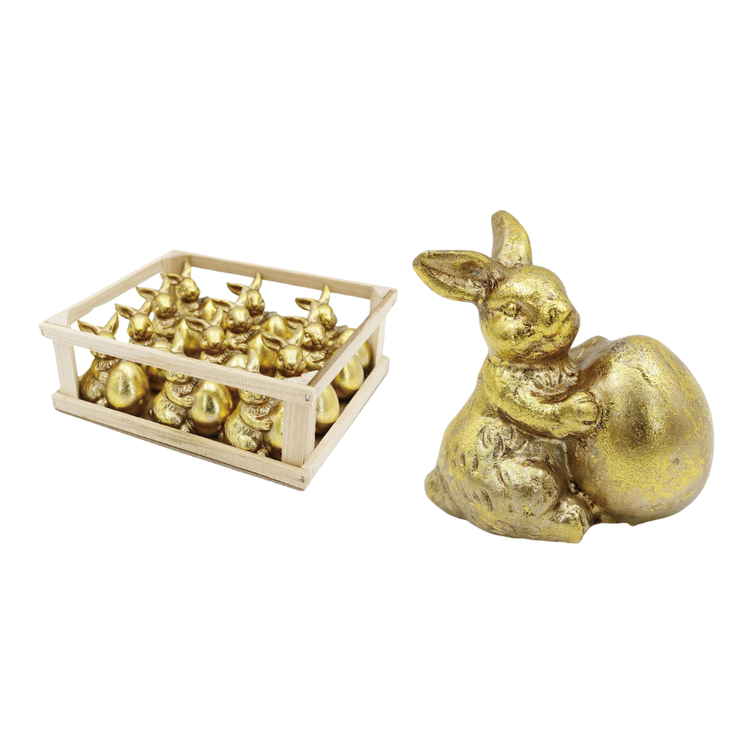 Mini resin gold bunny figurine holding a small egg