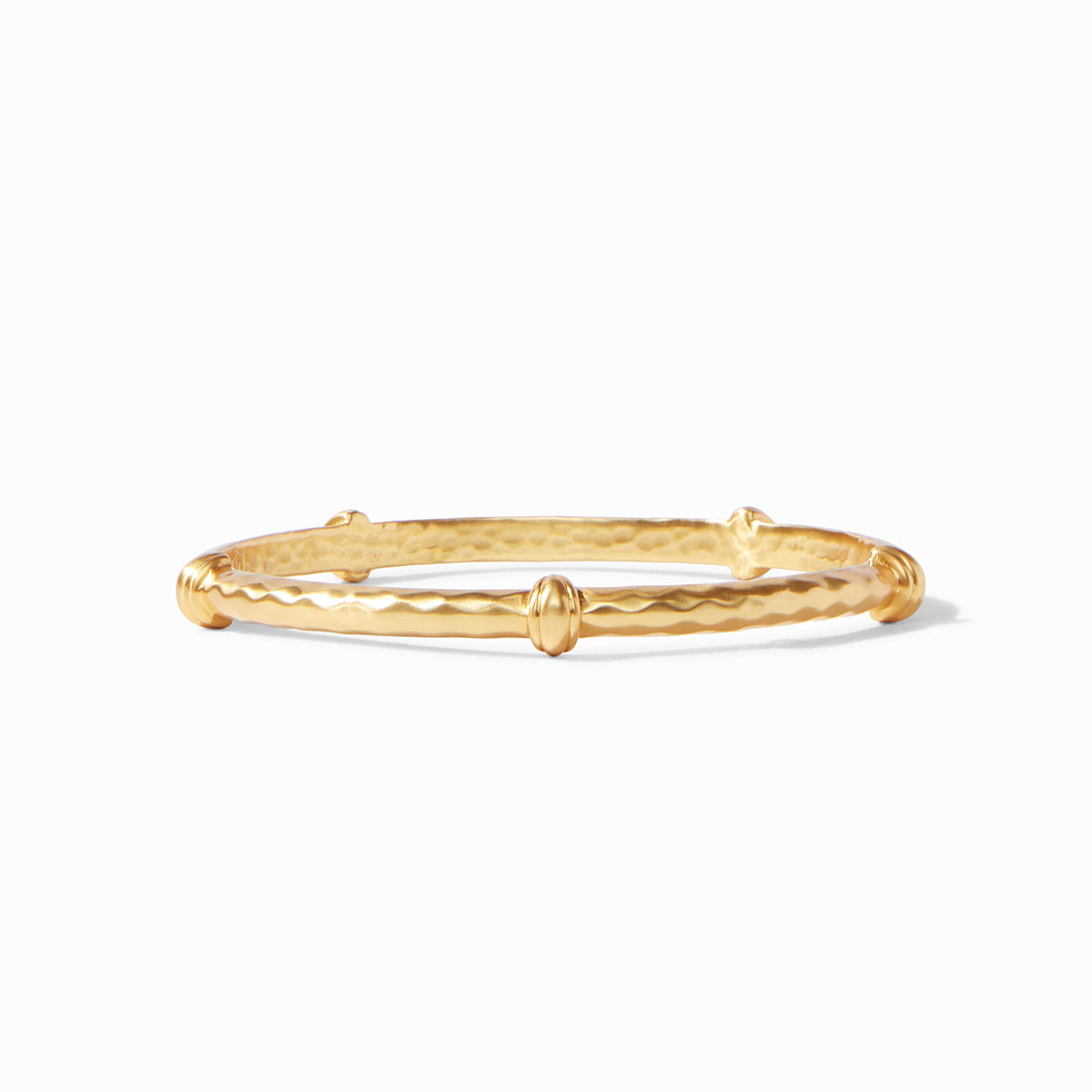 Savannah Bangle in gold featuring a hammered texture and four decorative stations.