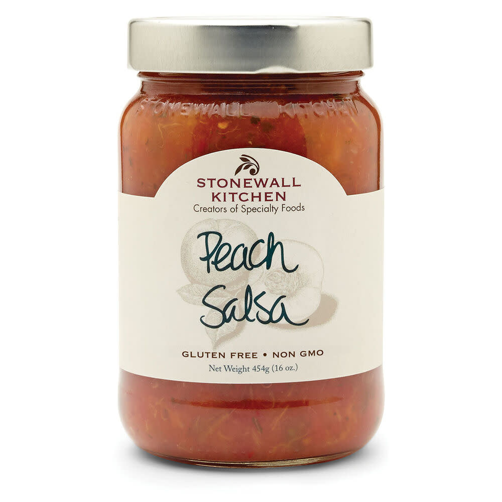 Open jar of peach salsa with visible peaches, tomatoes, jalapenos, and cilantro.