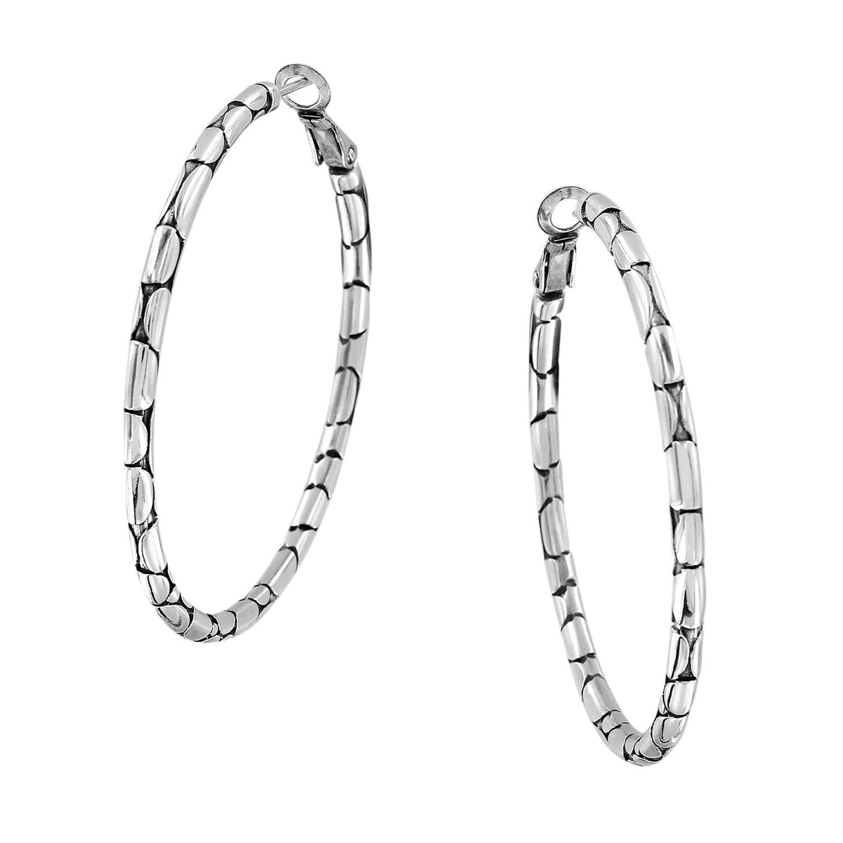 Silver plated large hoop earrings featuring a pebble texture with post lever backs.