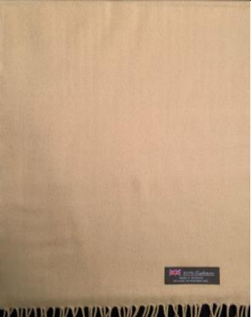 Tan cashmere scarf with a small label featuring a British flag and text at the bottom corner.