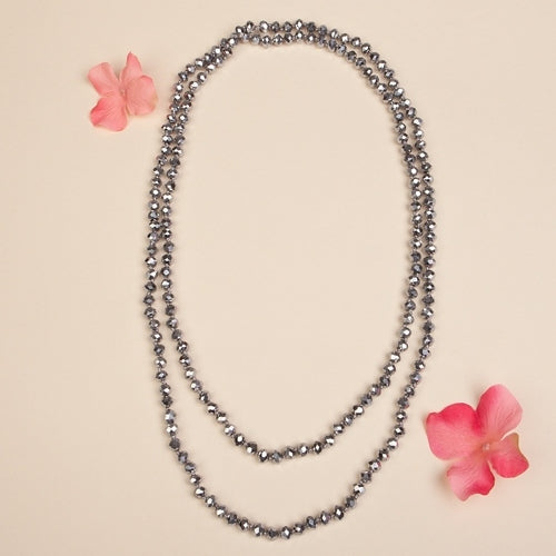 60-inch long necklace featuring clear crystal beads with a simple strand design