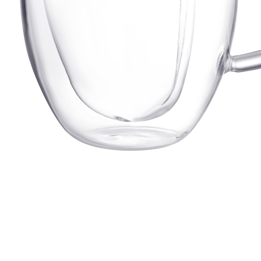 Close-up of the bottom of a double-walled clear glass heart-shaped espresso cup.