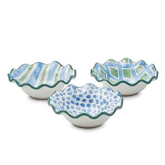 Set of three handmade ceramic berry bowls with green fluted rims featuring dot patterns