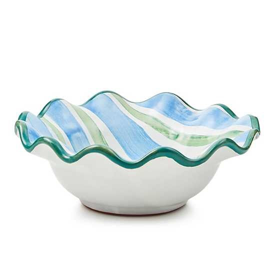 Hand-painted ceramic fluted berry bowl with green rim trim in a striped dot pattern.