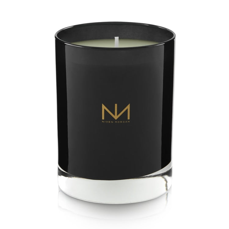 Dark navy glass candle with soy blend wax in Pepper Sage & Cedar scent