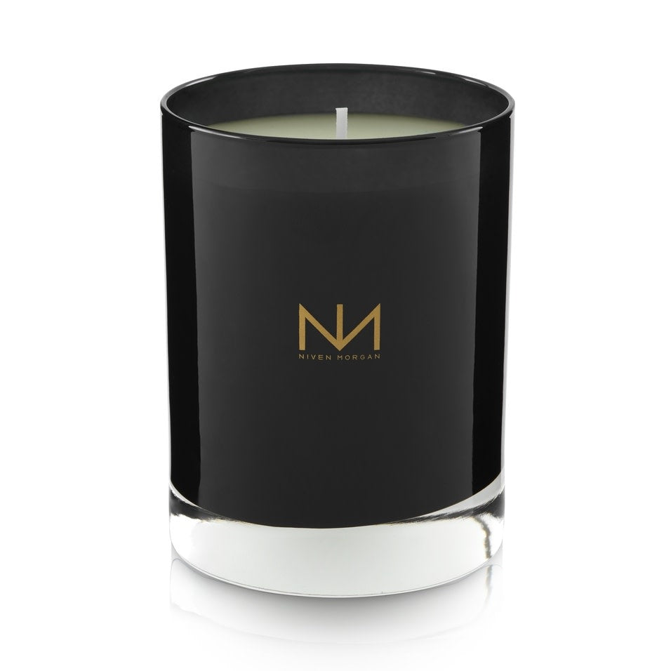 Dark navy glass candle with soy blend wax in Pepper Sage & Cedar scent