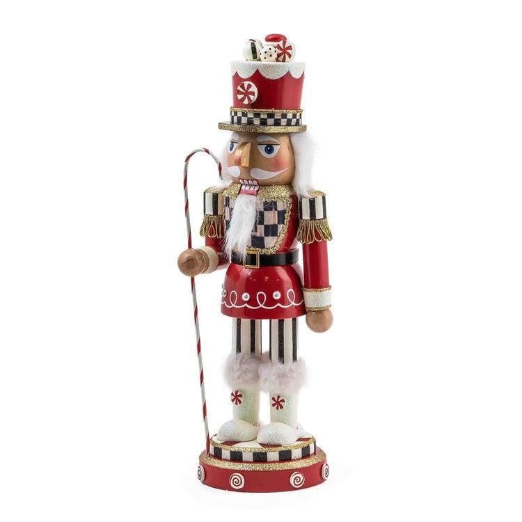 Hand-painted wooden nutcracker in red Courtly Check fabric with peppermint candies and candy cane