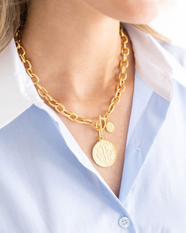 Textured gold toggle necklace featuring a 17th-century Peruvian cob coin pendant on an 16-inch chain.