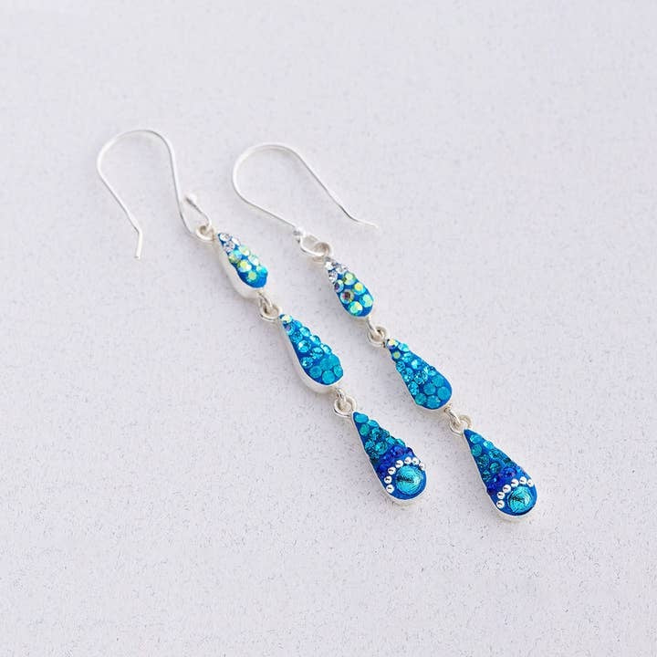 Sterling silver petite trickle earrings featuring a cascading pattern of Austrian crystals in clear and iridescent tones.