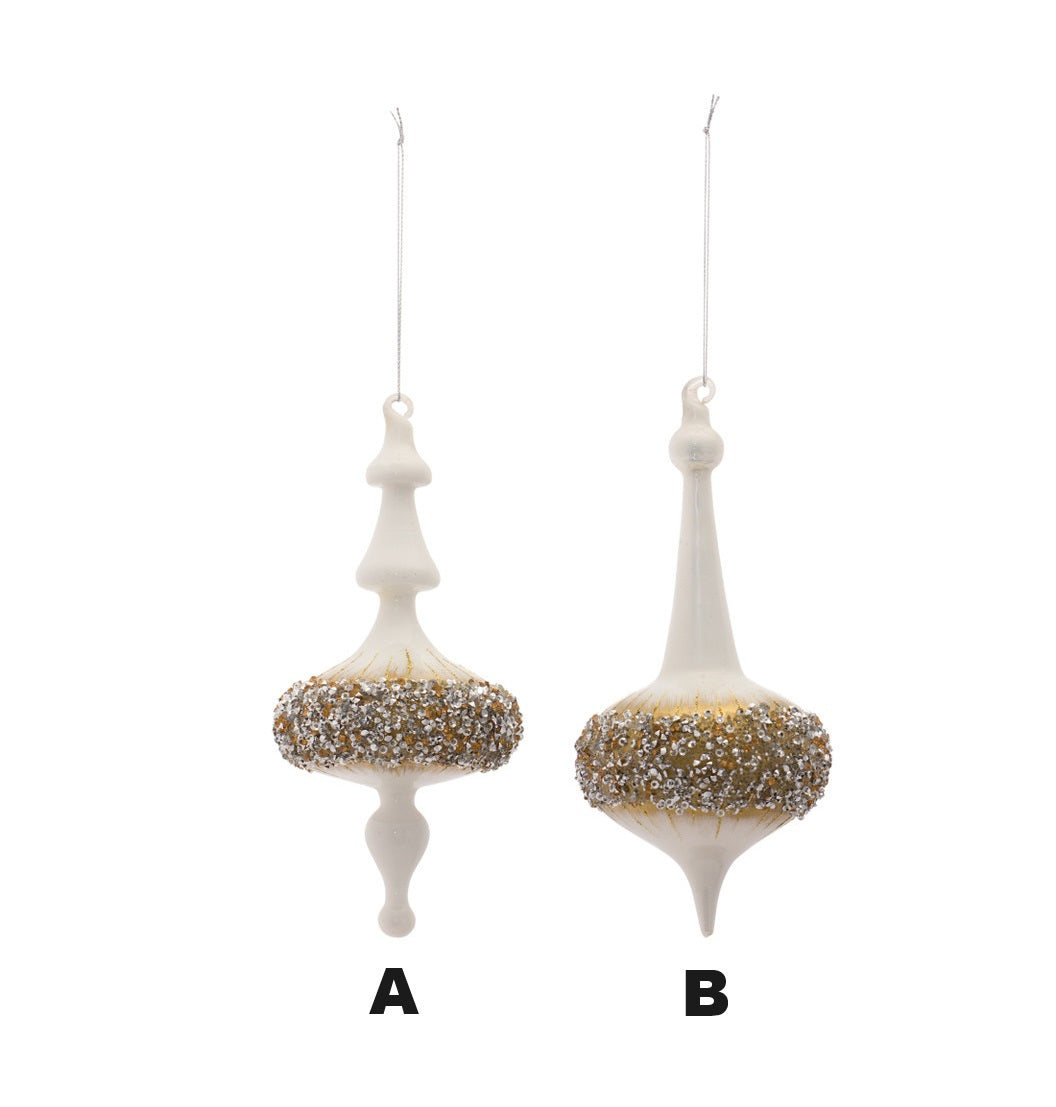 Two white finial glass ornaments with gold and silver glitter accents and hanging strings.