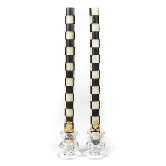 Set of two black dinner candles with ivory accents in a cylindrical glass jar.