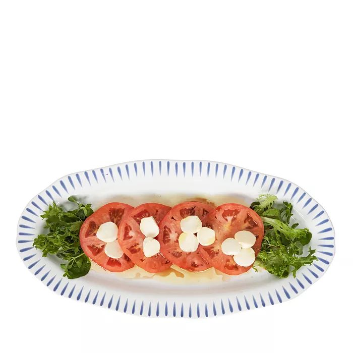 Sitio Stripe 15 inch Hostess Tray in Delft Blue with a tomato and mozzarella salad.