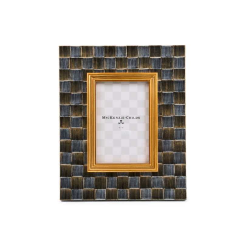 Sophisticheck 5” x 7” picture frame with a black and gold checkered pattern and inner gold border.