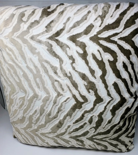 A 24x24 hand-crafted pillow with a textured zebra pattern in brown and cream.