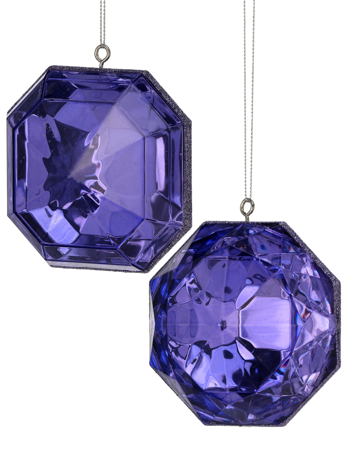 Two purple acrylic gem-shaped Christmas ornaments with faceted surfaces and hanging loops.