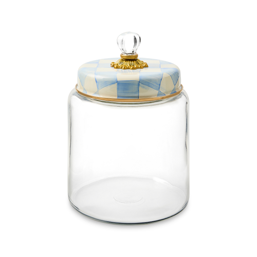 Glass kitchen canister with bronzed stainless steel lid rimmed in brass accents featuring a sky check pattern.