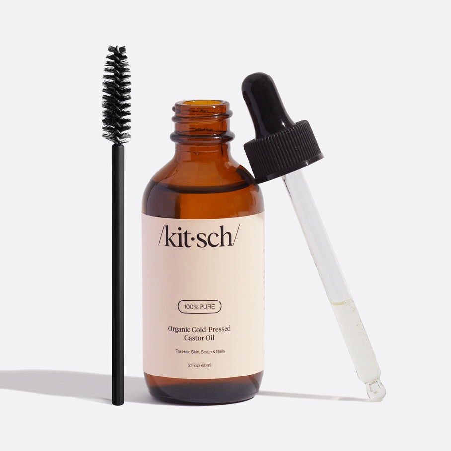 Bottle of USDA organic castor oil with a white label on a neutral background.