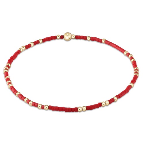 Hope Unwritten bracelet featuring mixed seed beads in various colors with gold-filled accents on elastic cord.