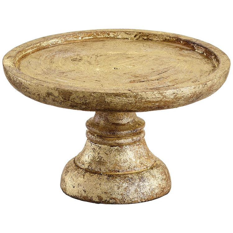 Gold and brown mango wood cake stand with a distressed finish and a pedestal base.