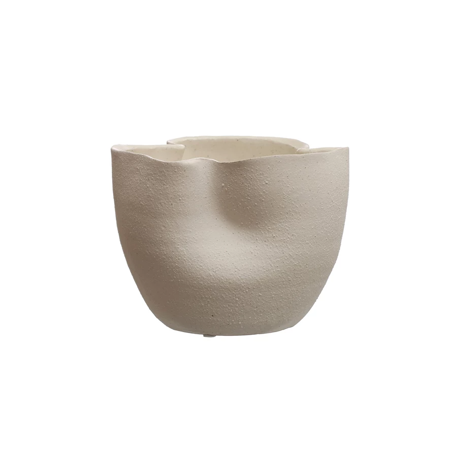 Stoneware ruffled planter with reactive glaze in a rounded silhouette featuring subtle surface texture variations.