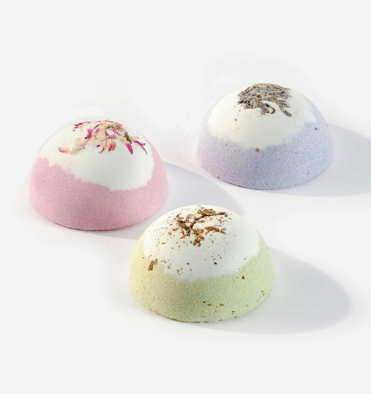 Garden Joy scented bath fizzer in a round container with green botanical pattern.