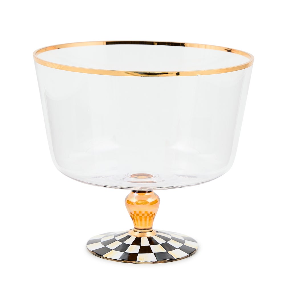 Clear glass trifle bowl with a gold-rimmed edge and a black and white checkered pedestal base.