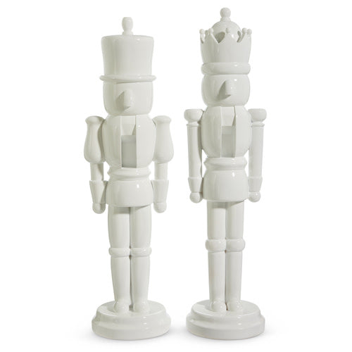 Two 22.5-inch white resin nutcrackers, one with a top hat and one with a crown, sold individually.