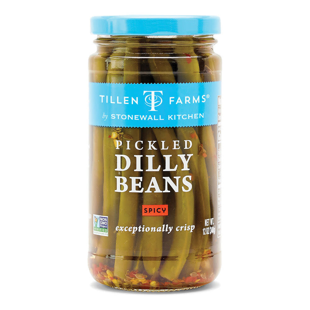 Jar of spicy pickled dilly beans with visible green beans in brine.